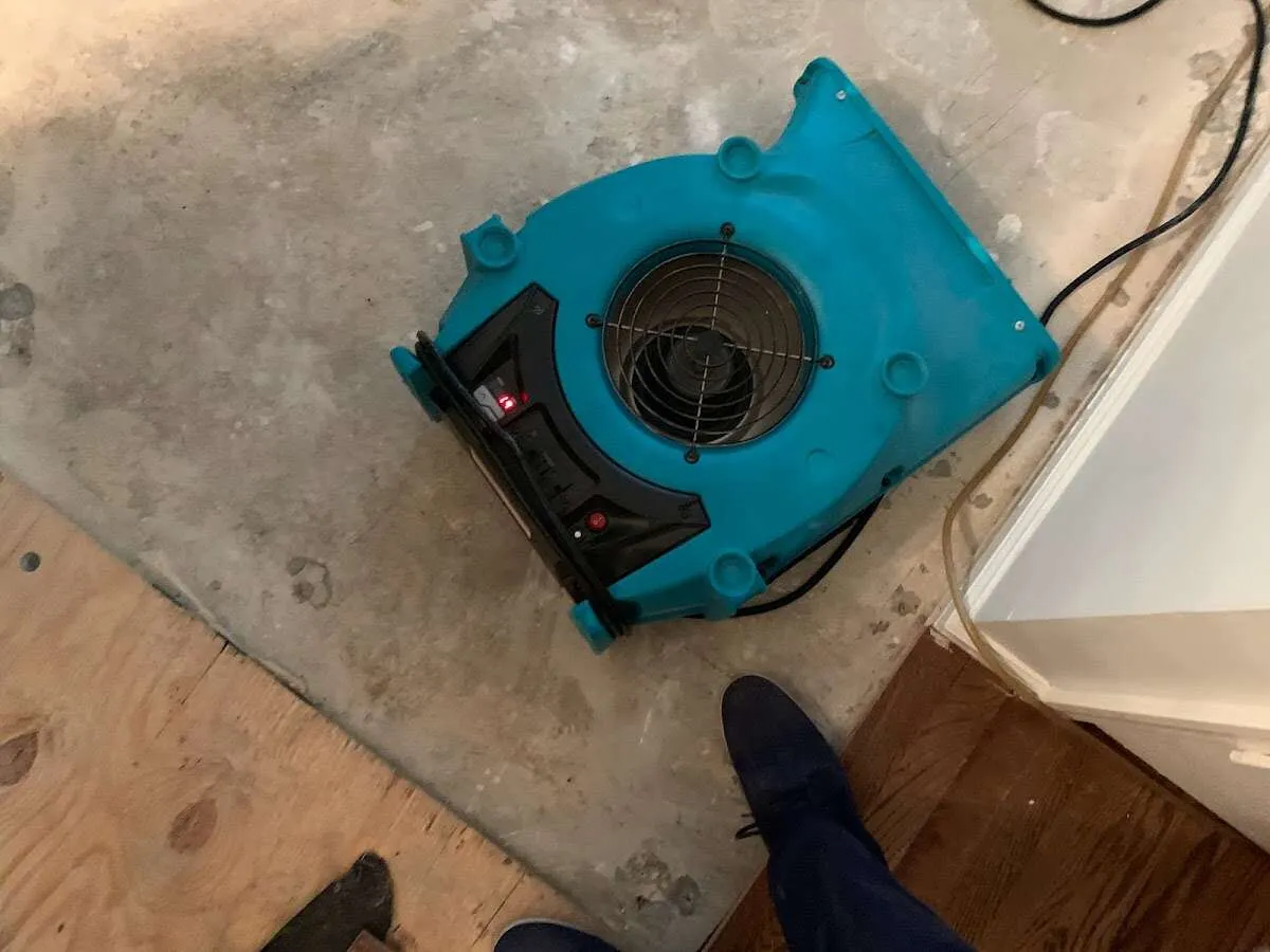 Air mover drying subfloor during Leak Detection & Repair in Morganton